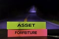 Asset Forfeiture on the sticky notes with bokeh background Royalty Free Stock Photo