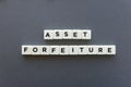 Asset forfeiture word made of square letter word on grey background. Royalty Free Stock Photo