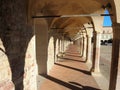 Assisi, Italy. The colonnade of the lower square of the Basilica and the Sacred Convent of Saint Francis