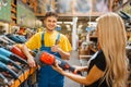 Assistant and female purchaser in hardware store