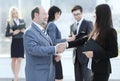 Assistant meets a businessman with a handshake. meetings and partnership Royalty Free Stock Photo