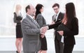 Assistant meets a businessman with a handshake. meetings and partnership Royalty Free Stock Photo