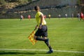 Assistant referee in a football match watching the game