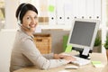 Assistant talking on headset Royalty Free Stock Photo