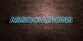 ASSOCIATIONS - fluorescent Neon tube Sign on brickwork - Front view - 3D rendered royalty free stock picture