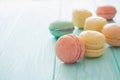 Assortment of macarons on blue wood background