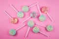 Assorment of colorful lollipop on pink background