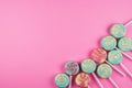 Assorment of colorful lollipop on pink background