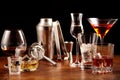 Assorted alcoholic beverages and bar utensils Royalty Free Stock Photo