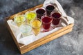 Assorted alcoholic cordials in a wooden box. Alcoholic drinks