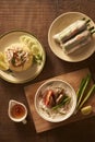 Assorted asian dinner, vietnamese food. Chicken rice, bun cha ca Royalty Free Stock Photo