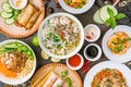 Assorted asian dinner, vietnamese food. Pho ga, pho bo, noodles, spring rolls top view