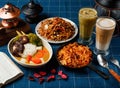 Assorted Aw Vegetable Curry, Grilled Spicy Chow Mein, Fried Instant Noodles with Fried Sauce, latte, Matcha Coffee Latte served in