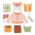 Assorted Baby Clothes Set on a white background.