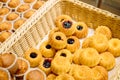 Assorted bakery.Cupcakes in the basket close-up. background