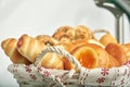 Assorted bakery products in a wicker basket. Delicious dessert. Junk food