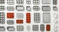 Assorted Baking Pans and Molds in Rows on White Flat Lay Arrangement Metal and Silicone Colorful Baking Tools for Royalty Free Stock Photo