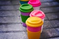 Assorted bamboo travel reusable coffee or tea cups mugs with silicone cap. Royalty Free Stock Photo