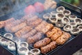 Assorted barbecue of meat rolls or mici and champignon mushrooms Royalty Free Stock Photo