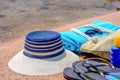 Assorted beach accessories on the sand Royalty Free Stock Photo