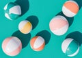 Assorted Beach Balls on Teal Background Top View