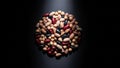 Assorted beans and legumes arranged in dark lighting for texture and variety study Royalty Free Stock Photo
