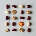 Assorted beans and lentils arranged in a grid pattern on a light gray surface. The Royalty Free Stock Photo