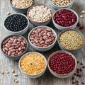 Assorted beans and lentils in ceramic bowls arranged on a rustic wooden Royalty Free Stock Photo