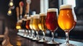 Assorted Beer Glasses Aligned on Bar Counter Royalty Free Stock Photo