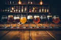 Assorted beer glasses on wooden table, great for brewery or pub concept with vibrant colors Royalty Free Stock Photo