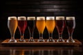 Assorted beer glasses on wooden table, vibrant colors and textures for brewery or pub concept Royalty Free Stock Photo