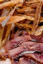 Assorted beer snacks: fried mussels, dried fish, french fries, cheese sticks on kraft paper on a tray Royalty Free Stock Photo