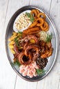 Assorted beer snacks. Sausages, croutons, fried onion rings, shrimps Royalty Free Stock Photo