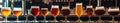 Assorted Beers in Row of Glasses Royalty Free Stock Photo