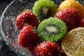 Assorted berries and kiwi in bowl Royalty Free Stock Photo