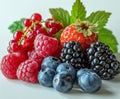 Assorted Berries and Raspberries on White Surface. Close-up Fresh Fruit Arrangement Royalty Free Stock Photo
