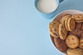 Assorted biscuits in bowl with cup milk Royalty Free Stock Photo