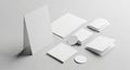 Assorted blank stationery items arranged on a gray background, including a folded card Royalty Free Stock Photo