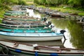 Different boats for rent tied to small pier on Lough Leane, the largest and northernmost of the three lakes of Killarney National