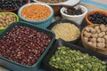 assorted bowls with raw grain and seeds top view