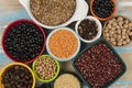 assorted bowls with raw grain and seeds top view