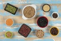 assorted bowls with raw grain and seeds top view