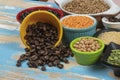 assorted bowls with raw grain and seeds top view