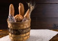 Assorted bread and baguettes in a rustic basket Royalty Free Stock Photo