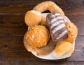 Assorted bread rolls and a bagel on a plate Royalty Free Stock Photo