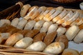 Assorted Bread Rolls and Sliced Loaf in Rustic Bakery Display Royalty Free Stock Photo