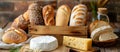 Assorted Breads and Cheeses on Table Royalty Free Stock Photo