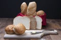 Assorted breads and a pad of butter. Royalty Free Stock Photo