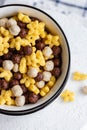 Assorted breakfast cereals: chocolate balls and honey stars Royalty Free Stock Photo