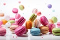 Colorful macarons in mid-air with white background